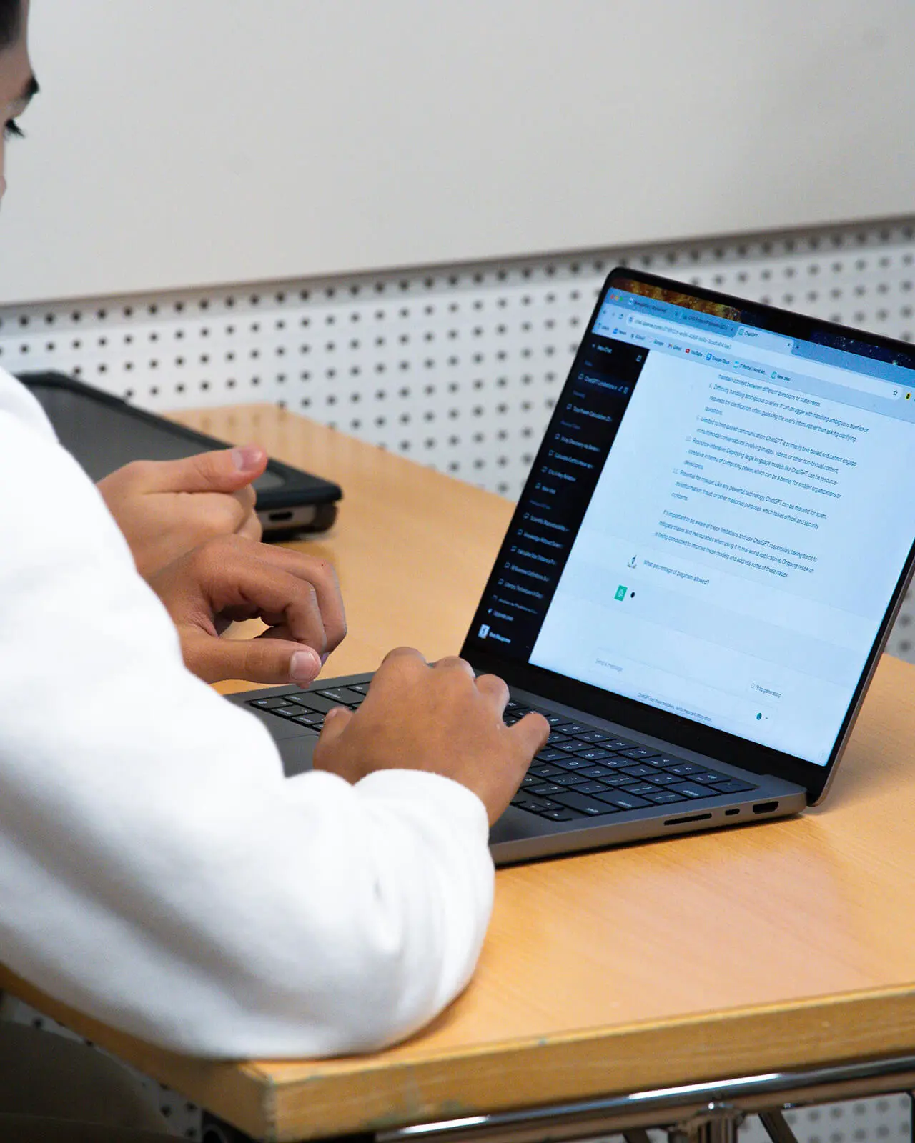 Student at Beau Soleil working on a laptop as they learn about AI and ChatGTP